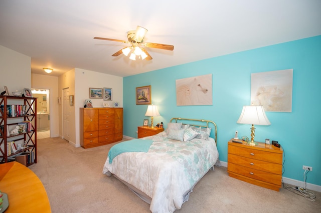 8400 Callie Ave Unit 206, Morton Grove, IL 60053 - bedroom featuring carpet, baseboards, connected bathroom, and a ceiling fan
