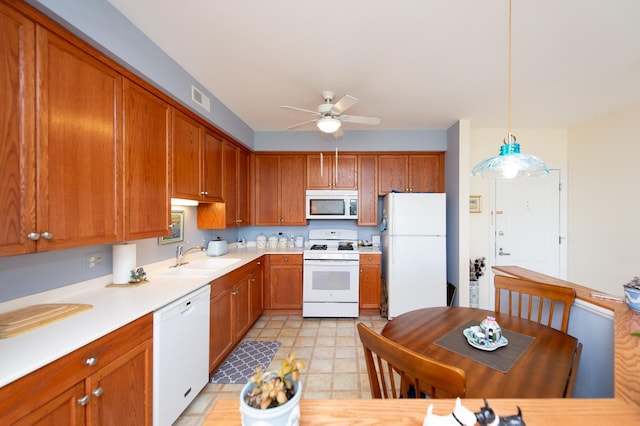 8400 Callie Ave Unit 206, Morton Grove, IL 60053 - kitchen with white appliances, a sink, ceiling fan, light countertops, and brown cabinetry