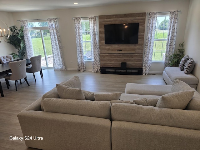 12305 S Prairie Ridge Ln, Plainfield, IL 60585 - living room featuring healthy amount of natural light, light wood-type flooring, a chandelier, and recessed lighting