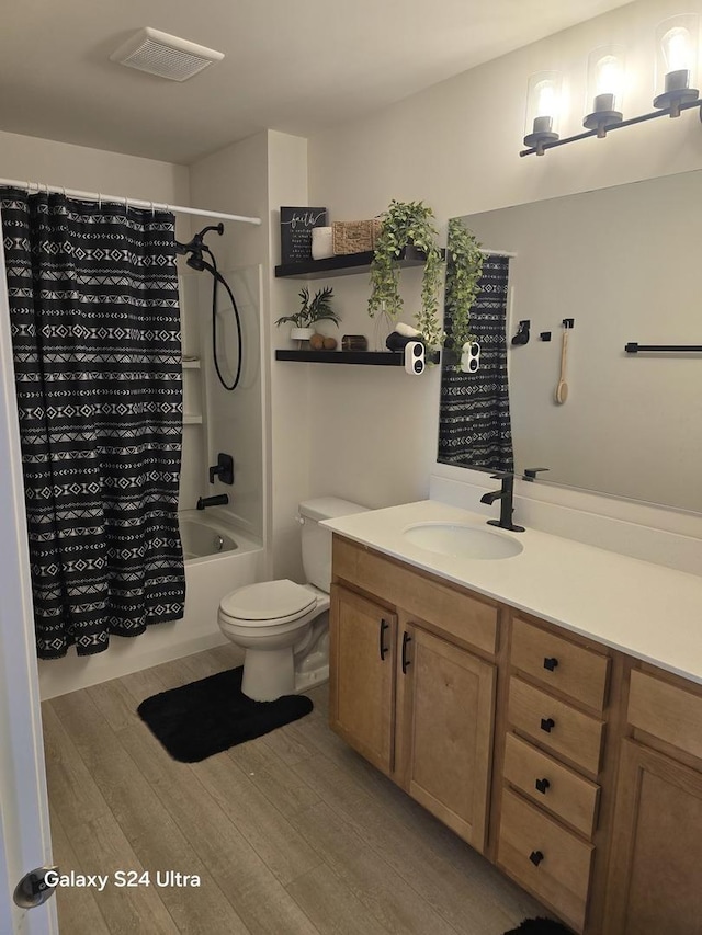 12305 S Prairie Ridge Ln, Plainfield, IL 60585 - full bathroom with wood finished floors, shower / tub combo with curtain, and vanity