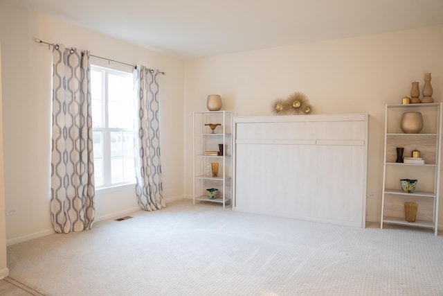 12305 S Prairie Ridge Ln, Plainfield, IL 60585 - unfurnished bedroom with light colored carpet and multiple windows
