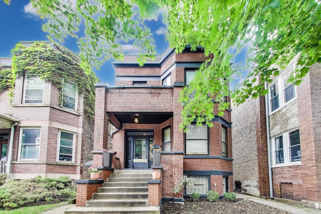 4433 N Artesian Ave, Chicago, IL 60625 - view of front of house featuring a balcony and brick siding