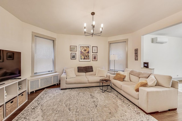 4433 N Artesian Ave, Chicago, IL 60625 - living room with radiator, dark wood-style flooring, a chandelier, and a wall unit AC