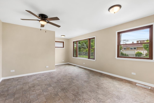 5471 N Octavia Ave, Chicago, IL 60656 - spare room featuring a ceiling fan, baseboards, and wood finished floors