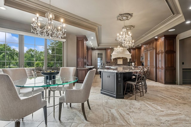 14 Vandenbergh Dr, South Barrington, IL 60010 - dining space featuring a chandelier, ornamental molding, a tray ceiling, light marble finish flooring, and recessed lighting
