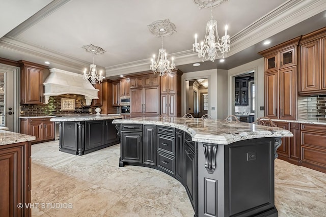 14 Vandenbergh Dr, South Barrington, IL 60010 - kitchen featuring a chandelier, a spacious island, custom range hood, light marble finish flooring, and ornamental molding