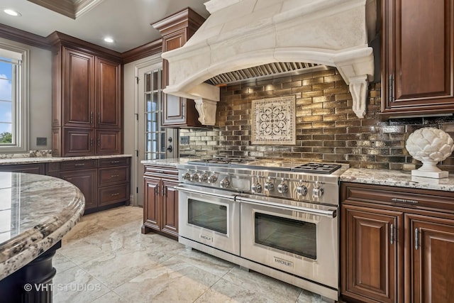 14 Vandenbergh Dr, South Barrington, IL 60010 - kitchen with double oven range, custom exhaust hood, tasteful backsplash, crown molding, and light stone countertops