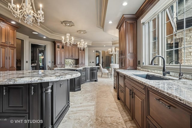 14 Vandenbergh Dr, South Barrington, IL 60010 - kitchen with a chandelier, tasteful backsplash, a raised ceiling, hanging light fixtures, and recessed lighting