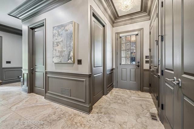14 Vandenbergh Dr, South Barrington, IL 60010 - mudroom featuring a decorative wall, crown molding, light marble finish floors, a chandelier, and a wainscoted wall
