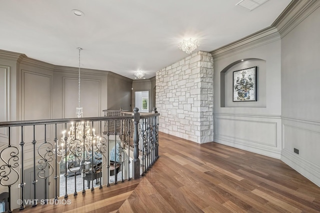 14 Vandenbergh Dr, South Barrington, IL 60010 - corridor featuring a chandelier, wood finished floors, a decorative wall, an upstairs landing, and ornamental molding