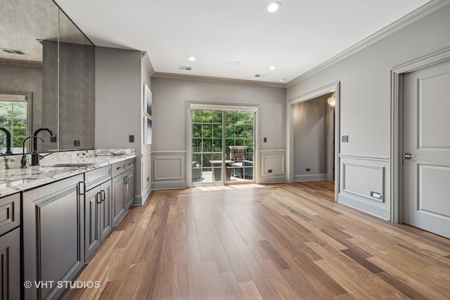 14 Vandenbergh Dr, South Barrington, IL 60010 - bathroom featuring a decorative wall, vanity, wood finished floors, ornamental molding, and a wainscoted wall