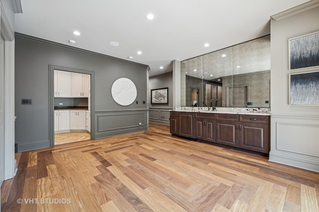 14 Vandenbergh Dr, South Barrington, IL 60010 - bathroom with crown molding, a decorative wall, vanity, wood finished floors, and recessed lighting