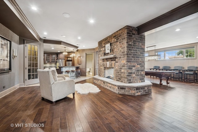 14 Vandenbergh Dr, South Barrington, IL 60010 - living room featuring dark wood-type flooring, pool table, ornamental molding, a brick fireplace, and recessed lighting