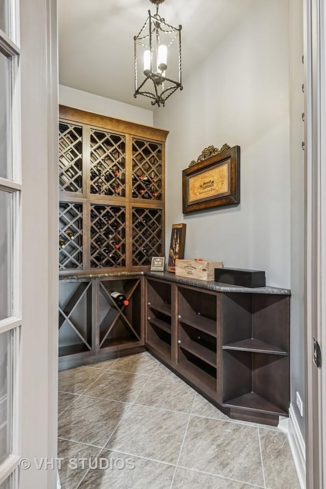 14 Vandenbergh Dr, South Barrington, IL 60010 - wine area with tile patterned floors and a chandelier