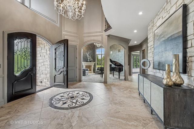14 Vandenbergh Dr, South Barrington, IL 60010 - foyer entrance featuring ornamental molding, a chandelier, arched walkways, recessed lighting, and a high ceiling