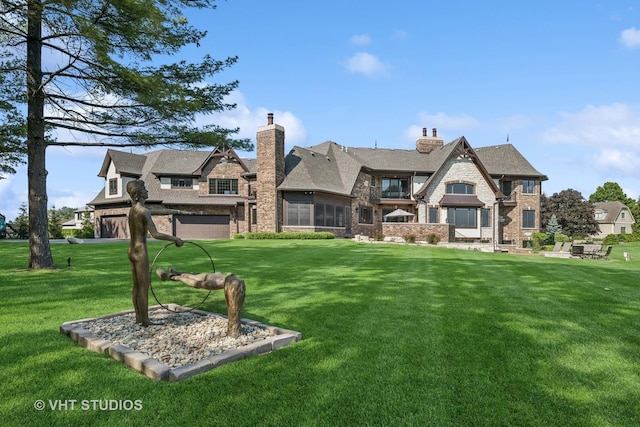 14 Vandenbergh Dr, South Barrington, IL 60010 - back of property featuring a lawn, a garage, a chimney, and brick siding