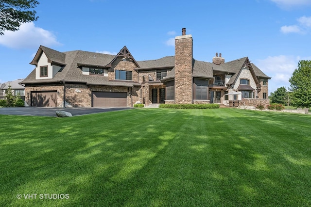 14 Vandenbergh Dr, South Barrington, IL 60010 - view of front of house with a front lawn, brick siding, an attached garage, a chimney, and roof with shingles