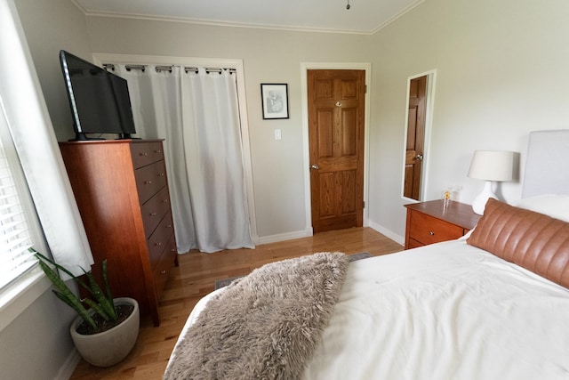 307 Highland Rd, Grayslake, IL 60030 - bedroom featuring light wood-style flooring and ornamental molding