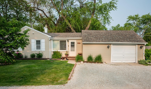 307 Highland Rd, Grayslake, IL 60030 - view of front facade featuring driveway, a shingled roof, a front lawn, and an attached garage