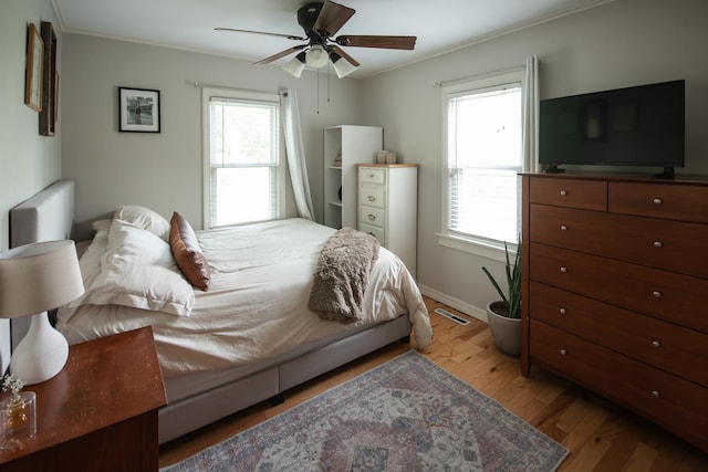 307 Highland Rd, Grayslake, IL 60030 - bedroom featuring wood finished floors, crown molding, and a ceiling fan