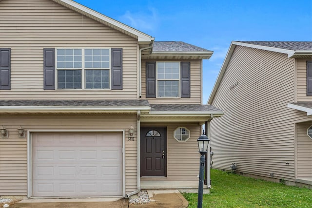3418 Stoneway Ct, Champaign, IL 61822 - view of front of property with a garage and roof with shingles