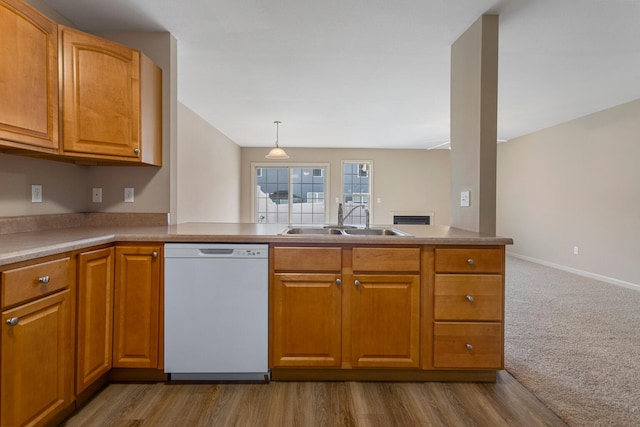 3418 Stoneway Ct, Champaign, IL 61822 - kitchen featuring white dishwasher, a sink, a peninsula, and brown cabinetry