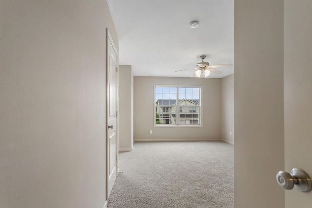 3418 Stoneway Ct, Champaign, IL 61822 - carpeted spare room with a ceiling fan, a smoke detector, and baseboards