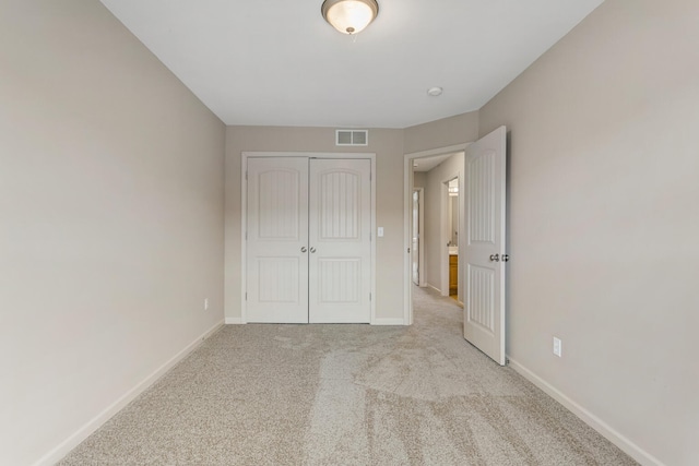 3418 Stoneway Ct, Champaign, IL 61822 - unfurnished bedroom featuring light carpet, baseboards, and a closet
