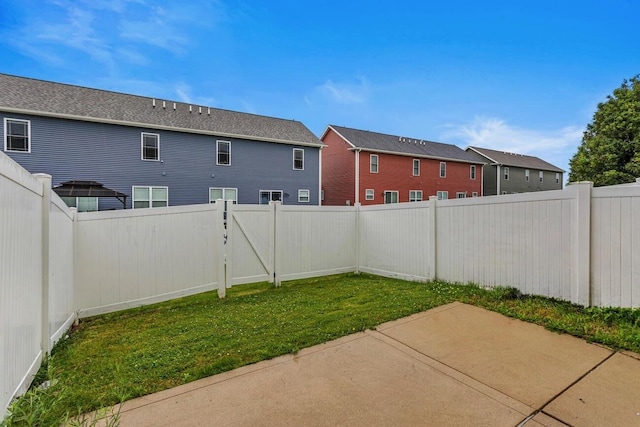 3418 Stoneway Ct, Champaign, IL 61822 - view of yard featuring a patio, a gate, and a residential view