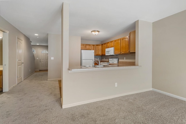 3418 Stoneway Ct, Champaign, IL 61822 - kitchen with white appliances, light colored carpet, baseboards, light countertops, and a sink