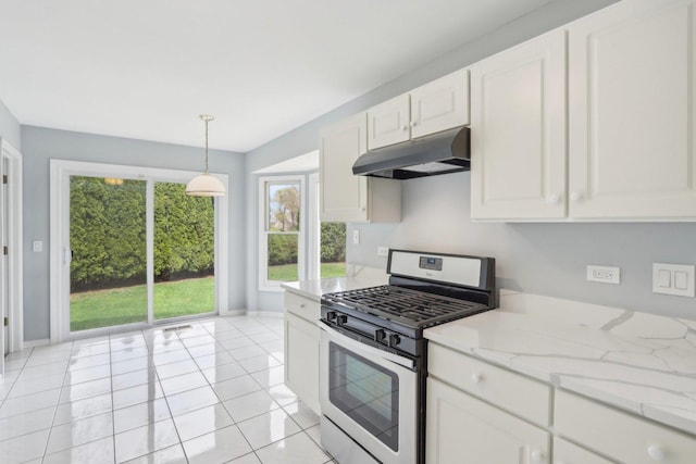 1173 Lamb Ln, Gurnee, IL 60031 - kitchen with under cabinet range hood, stainless steel range with gas stovetop, white cabinetry, and baseboards