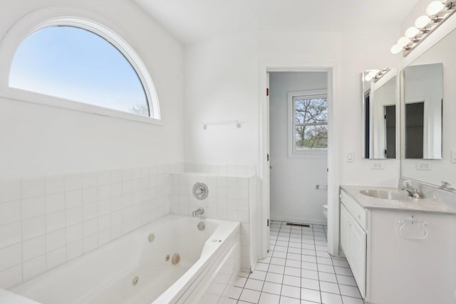 1173 Lamb Ln, Gurnee, IL 60031 - full bathroom with a whirlpool tub, vanity, tile patterned floors, and toilet