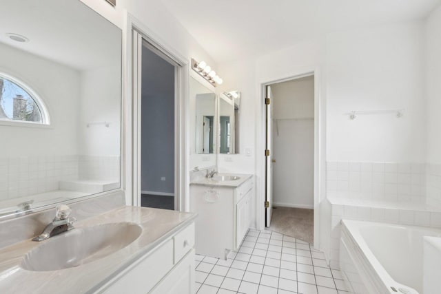 1173 Lamb Ln, Gurnee, IL 60031 - bathroom with two vanities, tile patterned flooring, and a garden tub