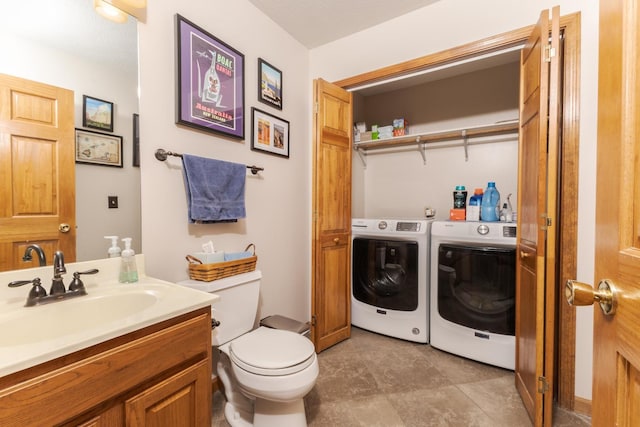 5 Tatiana Ct, Bloomington, IL 61704 - bathroom featuring washing machine and dryer and vanity
