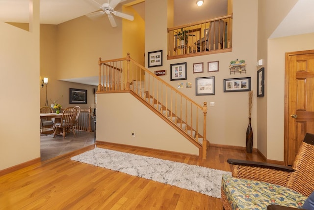 5 Tatiana Ct, Bloomington, IL 61704 - stairs featuring a high ceiling, wood finished floors, and ceiling fan