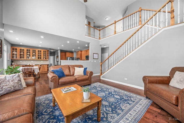 13825 Trillium Ln, Plainfield, IL 60544 - living area featuring dark wood-type flooring, baseboards, stairs, a towering ceiling, and recessed lighting
