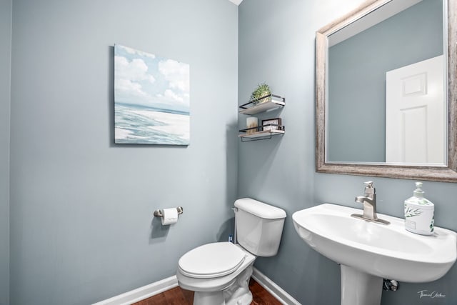 13825 Trillium Ln, Plainfield, IL 60544 - bathroom featuring wood finished floors, toilet, baseboards, and a sink