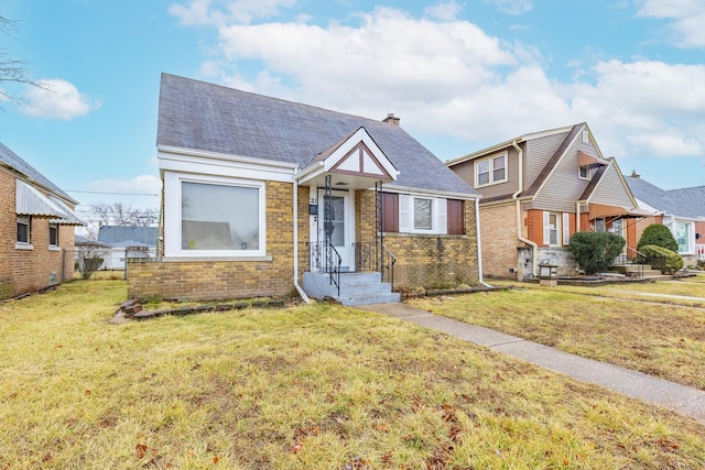 21 165th St, Calumet City, IL 60409 - view of front facade with brick siding and a chimney