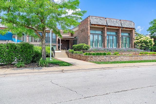3070 Pheasant Creek Dr Unit 201, Northbrook, IL 60062 - view of front of home featuring mansard roof and brick siding