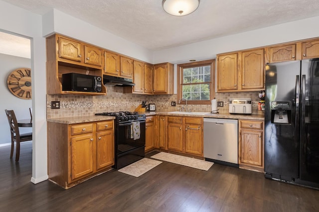 1613 Cutter Ct, Normal, IL 61761 - kitchen with black appliances, under cabinet range hood, dark wood-style flooring, tasteful backsplash, and a textured ceiling