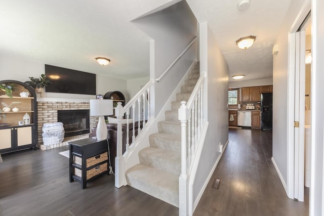 1613 Cutter Ct, Normal, IL 61761 - stairs featuring wood finished floors and a brick fireplace