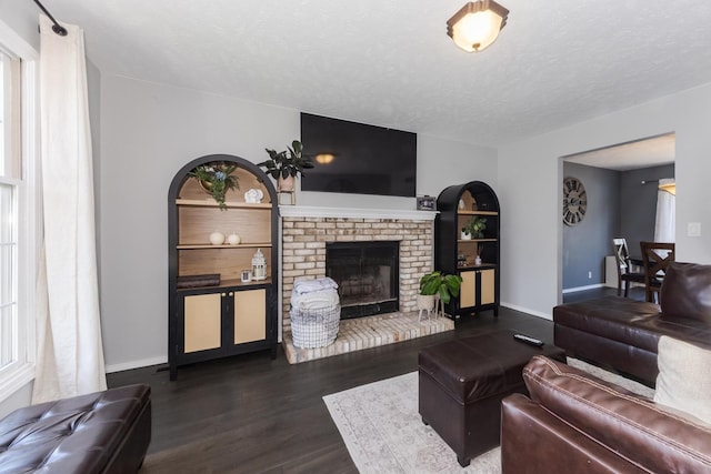 1613 Cutter Ct, Normal, IL 61761 - living area featuring dark wood finished floors, a textured ceiling, and a fireplace