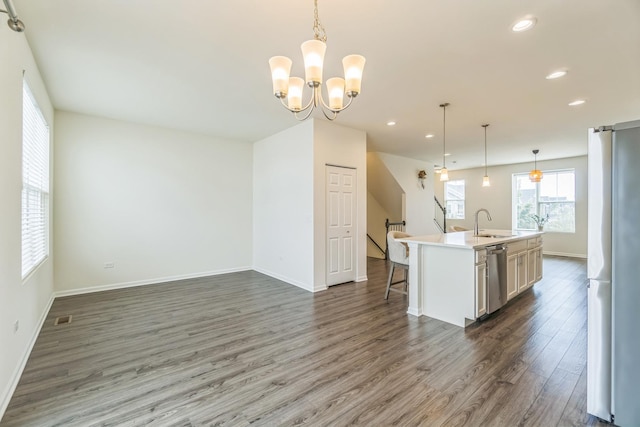 4138 Irving Rd, Aurora, IL 60504 - kitchen featuring dishwasher, freestanding refrigerator, wood finished floors, a sink, and baseboards