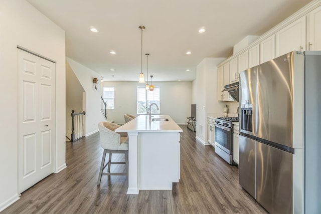 4138 Irving Rd, Aurora, IL 60504 - kitchen featuring stainless steel appliances, a kitchen island with sink, dark wood-style floors, and recessed lighting