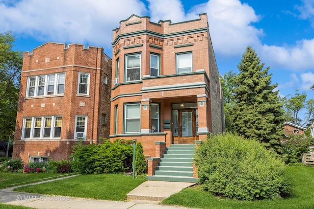 945 Elgin Ave, Forest Park, IL 60130 - view of front of property featuring brick siding, a front yard, and cooling unit