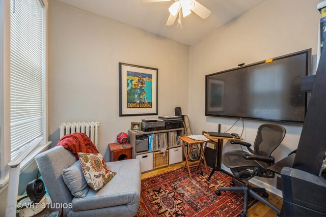 945 Elgin Ave, Forest Park, IL 60130 - office featuring radiator heating unit, wood finished floors, and a ceiling fan