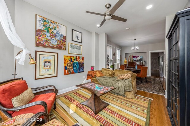 945 Elgin Ave, Forest Park, IL 60130 - living room with a chandelier, ceiling fan, wood finished floors, and recessed lighting