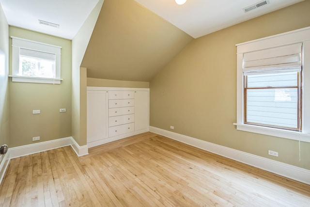 4248 N Sawyer Ave, Chicago, IL 60618 - bonus room with light wood-style flooring, lofted ceiling, and baseboards