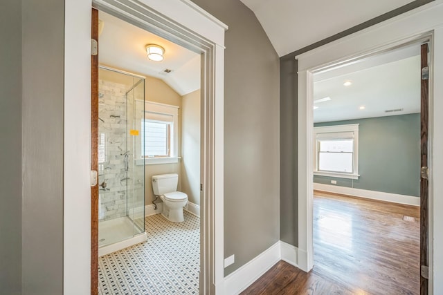 4248 N Sawyer Ave, Chicago, IL 60618 - bathroom with lofted ceiling, a shower stall, toilet, healthy amount of natural light, and baseboards