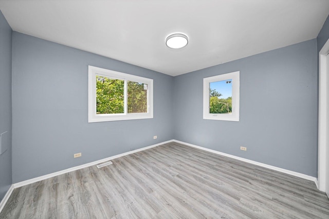 176 Monee Rd, Park Forest, IL 60466 - spare room with wood finished floors and baseboards